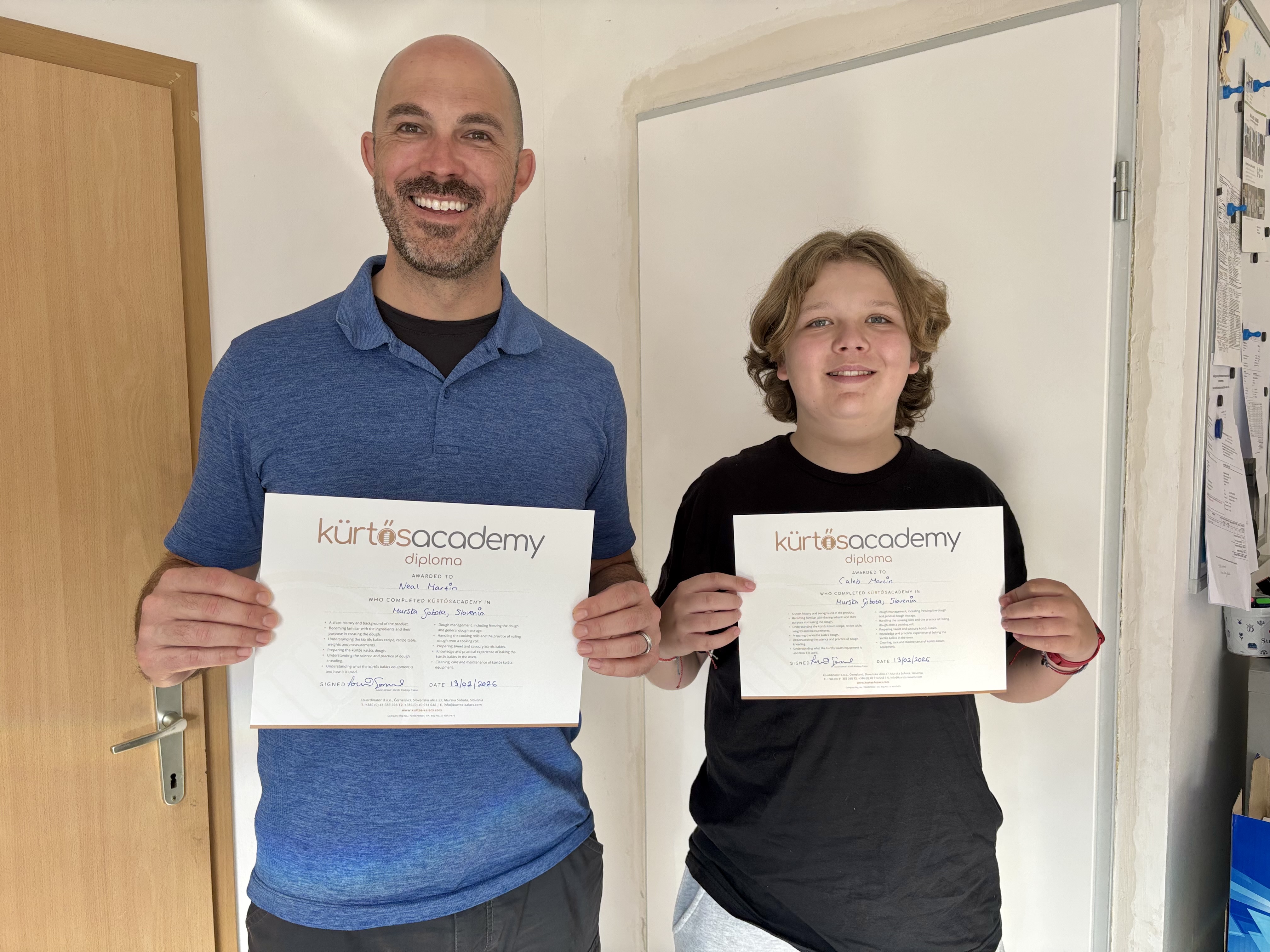Neal and Caleb Martin holding their Kürtős Academy diplomas in Slovenia